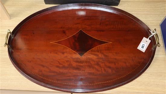 An Edwardian oval mahogany tray width 66cm